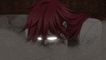 a man with red hair is wearing glasses and has a skull earring