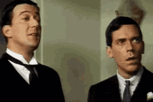 Hugh Laurie Sigh GIF - Hugh Laurie Sigh Relieved GIFs