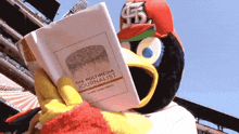 a cartoon bird is reading a book called the multimedia journalist