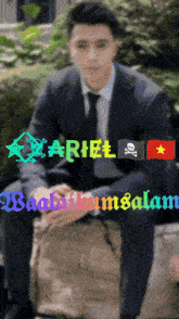 a man in a suit and tie sits on a rock with the words " ariel " written on the top