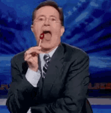 Lick Stephen Colbert GIF - Lick Stephen Colbert Lollipop GIFs