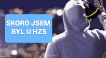 a man in a hoodie with a picture of a fireman on his head and the words skoro jsem byl u hzs below