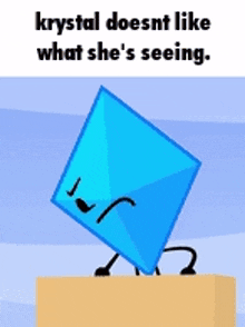 a blue object with a face and arms is standing on a box .