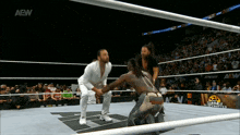 a wrestling match is being broadcasted on aew