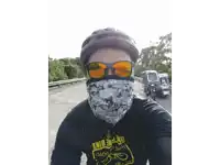 a man wearing a black shirt that says bike bike bike on it
