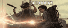 two young boys are playing with guns and lightning and the word scoducks is on the bottom of the image