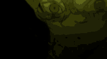 a shadow of a person 's hand is cast on a dark background