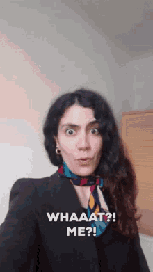 a woman taking a selfie with the words whaaat me written on the bottom