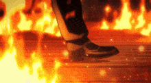 a person standing in front of a fire