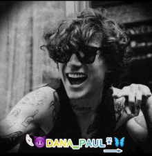 a black and white photo of a young man with dana paul written on the bottom