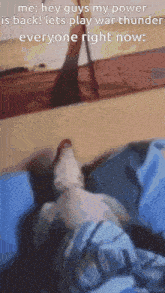 a cat is laying on a bed with a caption that says hey guys my power is back lets play war thunder everyone right now .