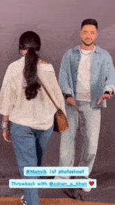 a man and a woman are standing next to each other and the man is wearing a denim jacket
