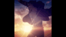a man is standing in front of a sunset with his arms outstretched and a sunset in the background .