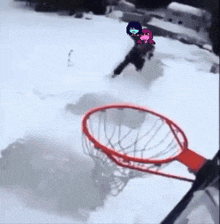 a person is playing basketball in the snow with a cartoon character on their head