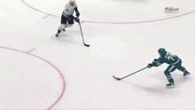 a hockey game is being played in front of a sign that says cache creek casino resort