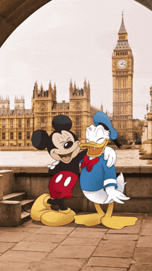 mickey mouse and donald duck are posing for a picture in front of big ben