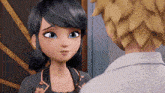 a cartoon girl is standing next to a man in a white shirt and looking at him .