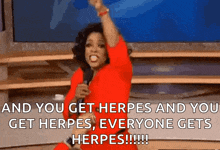 oprah winfrey is holding a microphone and saying " and you get herpes and you get herpes everyone gets herpes !!!