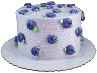 a cake with purple frosting and green flowers on it