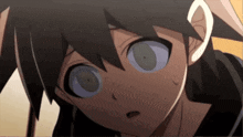 a close up of a person 's face with a surprised expression