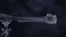 a video game character is holding a key in a dark room