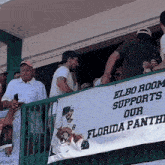 elbo room supports our florida panthers banner on a railing