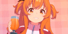 a girl with orange hair holds a glass of orange juice