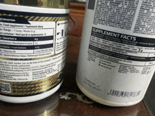 a bottle of supplement facts sits next to a bottle of food supplement