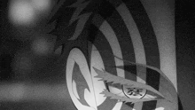 it is a black and white photo of a person 's face with a striped pattern on it .