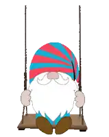 a gnome is sitting on a swing with a red and blue hat on