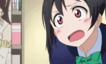 a girl with red eyes and a green bow tie looks shocked