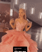 a woman in a pink dress is wearing a crown and the words wicked for good on the bottom