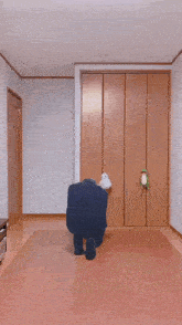a man in a suit dancing in a room