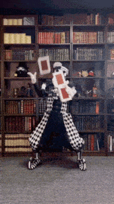 a man in a black and white checkered costume is holding a shield