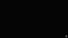 a blurred image of a green object with the letter b on it