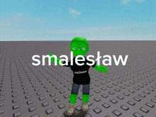a green cartoon character is standing on a brick floor with the words smalleslaw written above him .