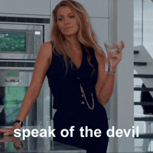 a woman is holding a martini in her hand and the words speak of the devil are above her