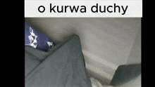a picture of a person laying on a bed with the words o kurwa duchy above it
