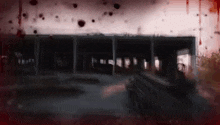 a blurry picture of a building with blood coming out of it