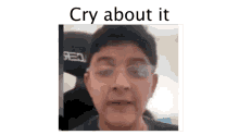 a close up of a man 's face with the words `` cry about it '' above it .