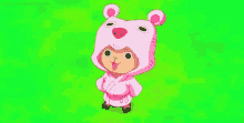 a cartoon character is wearing a pink bear costume and standing in a field .