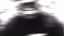 a close up of a person 's face in a blurry photo .