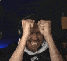 a man wearing headphones and a hoodie that says npc