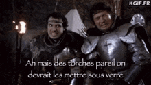 two men in armor are standing next to each other with the words ah mais des torches pareil on devrait les mettre sous verre