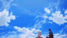 two men are sitting in front of a blue sky