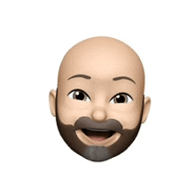 a cartoon face of a bald man with a beard and mustache smiling .