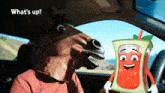 a man wearing a horse mask is driving a car next to a cartoon character