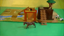 a toy set with animals and a sign that says ' safari park '