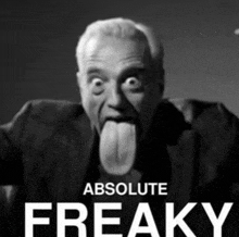 a black and white photo of a man sticking out his tongue with the words absolute freaky behind him