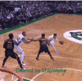 a basketball game is being played on a court owned by stay woke